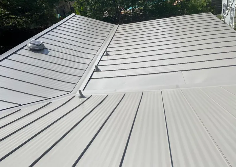 Solar attic fan installed on a metal roof for Roof Ventilation in Hughson